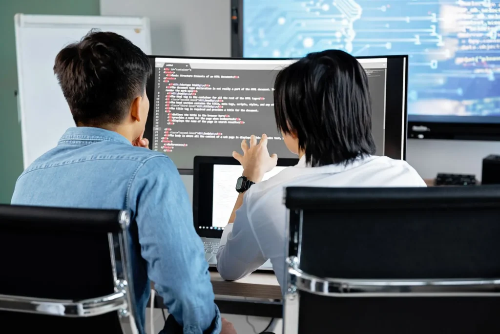 Two developers reviewing code together